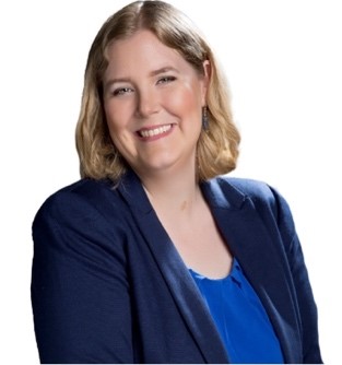 A person in a blue suit
Description automatically generated